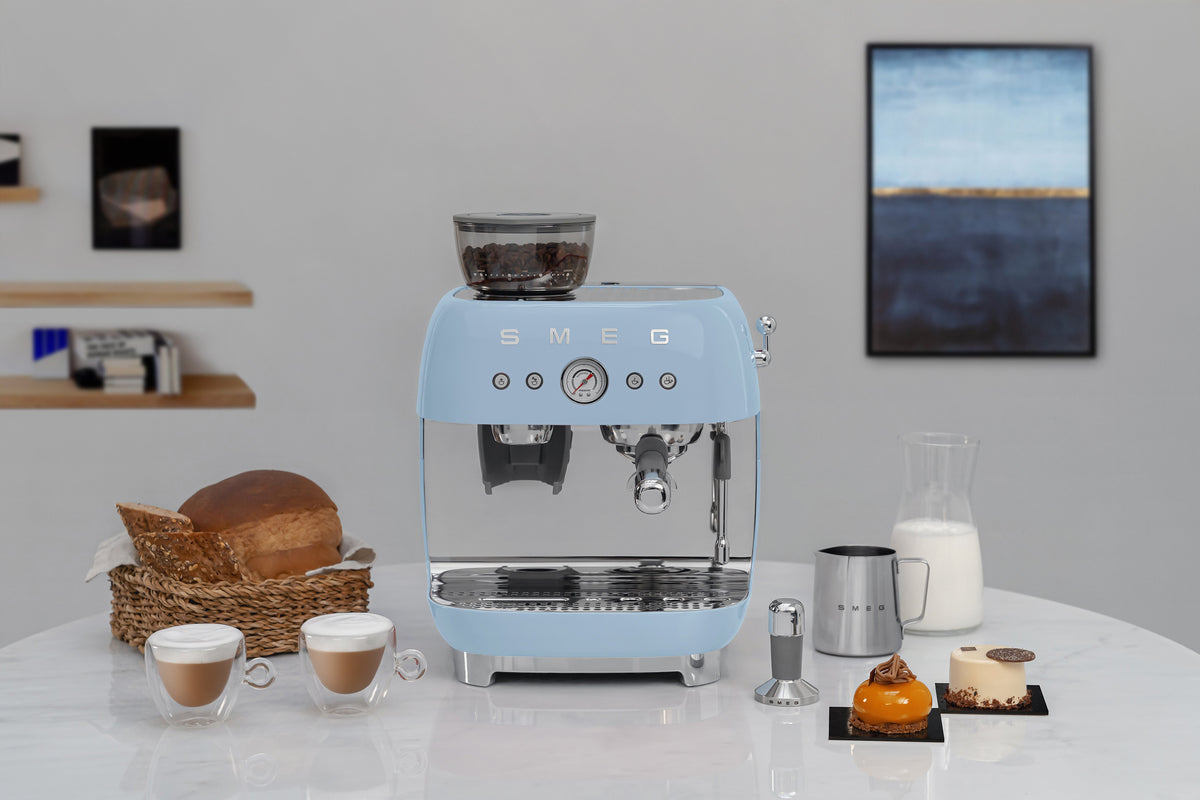 Espresso coffee machines with a grinder