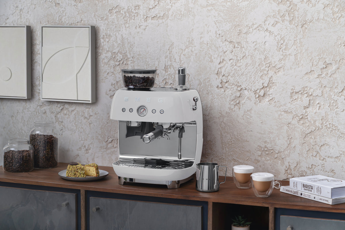Espresso coffee machines with a grinder
