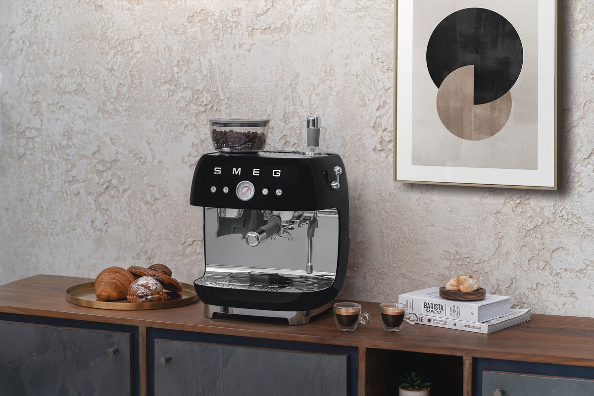 Espresso coffee machines with a grinder