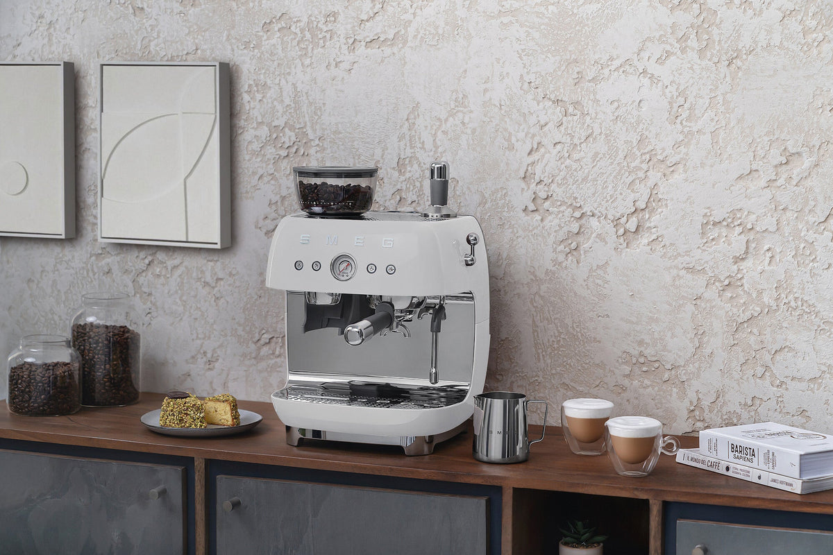 Espresso coffee machines with a grinder